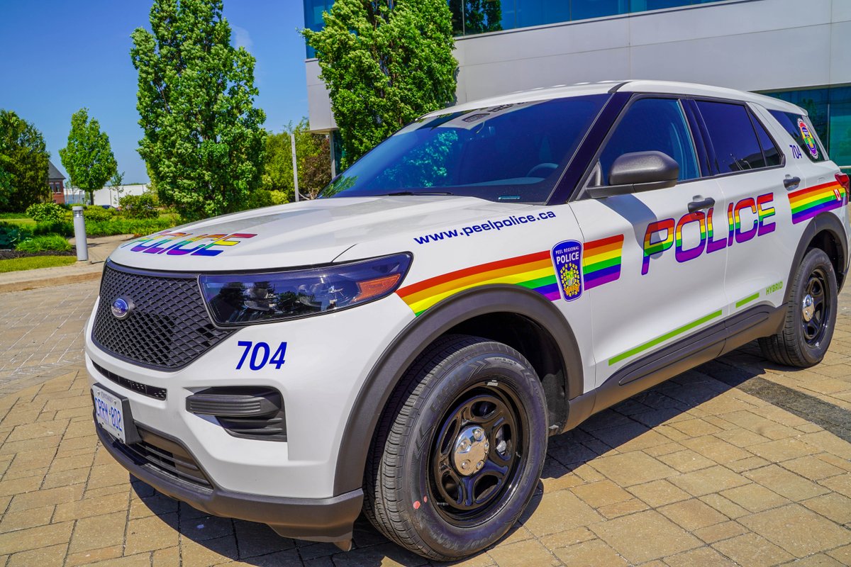 PeelPolice's tweet photo. The Pride flag is flying high at #PRP Headquarters as we celebrate #Pride2021! Watch for the special cruiser on our streets, and tag us in your photos with the vehicle! #PeelPolice #PeelRegionalPolice #Pride https://t.co/1M78ALTH8a