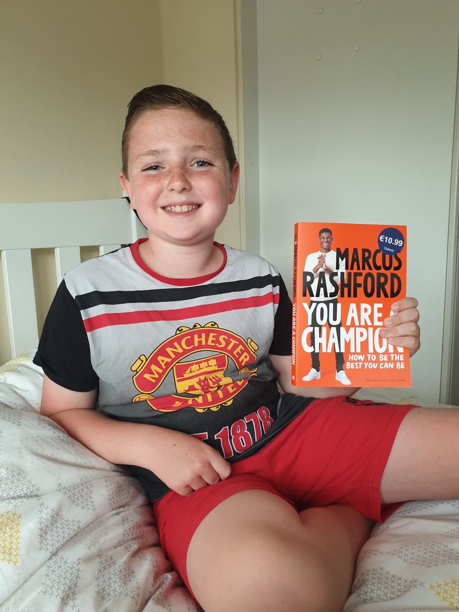 Must be a great read @MarcusRashford .. Finn hasn't left it out of his hands since he got it ⚽️⚽️ #YouAreAChampion