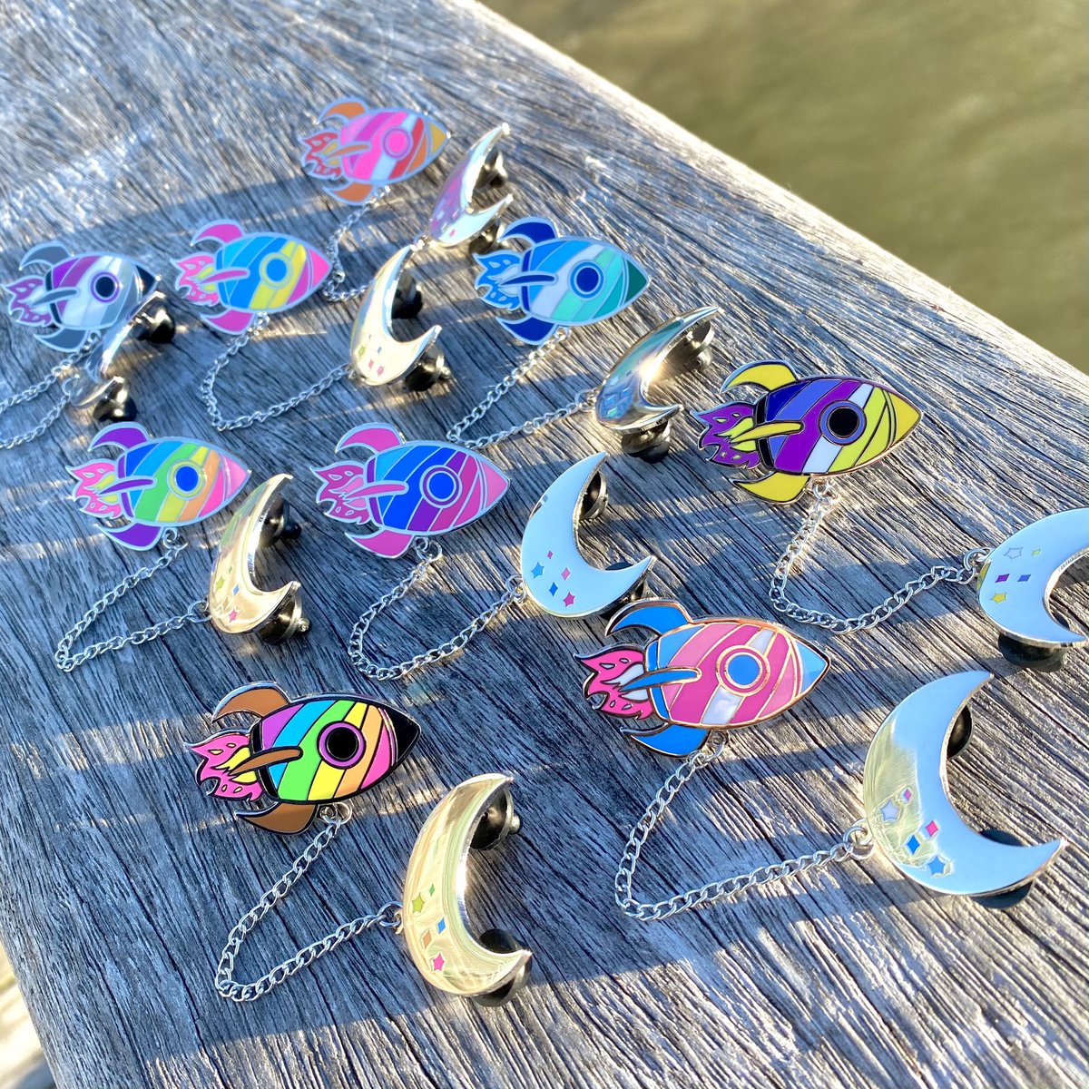Olovia's tweet photo. Good news! It’s Pride Month, and space CONTINUES to be gay!!! All three space pride pins 🪐🚀🌙☄️ are back in stock in my store, use code SPACEISGAY for 15% off orders of three or more!! 💖🌈✨ BE GAY DO SPACE https://t.co/KK8nxmWzna