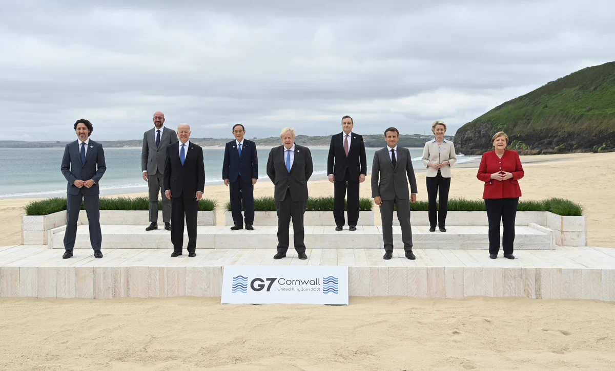 G7 leaders gather for a family photo on Carbis Bay Beach