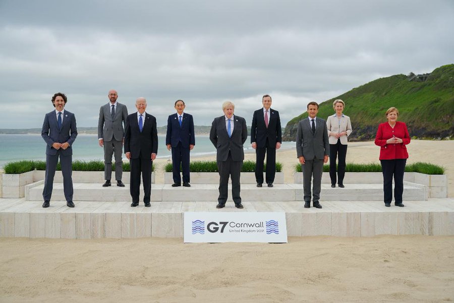 G7 leaders pose for a group picture.