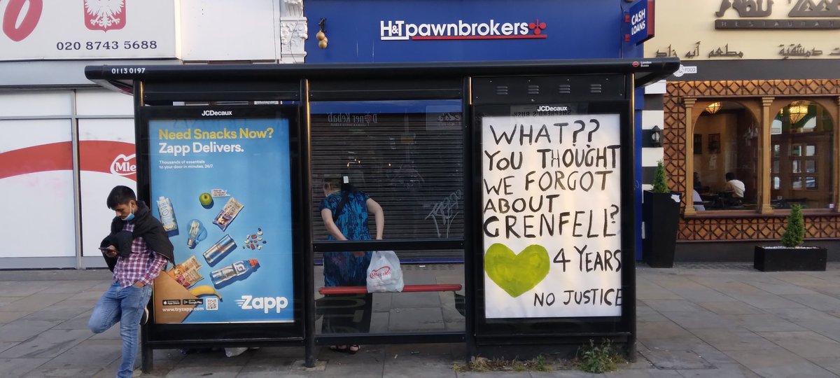 I was just walking up to the bus stop in Sheperd's Bush and there was a couple doing something to the ad hoading on the right ... they got this up astonishingly quickly 👊

#Justice4Grenfell 💚
