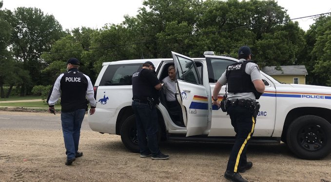 CBCAlerts's tweet photo. People's Party of Canada Leader Maxime Bernier arrested in Manitoba for allegedly breaking public health guidelines. Bernier spoke at 2 events, even though current guidelines prohibit all outdoor gatherings.  (Photo: CBC's Laïssa Pamou) Previous story: https://t.co/cS32phlbfY https://t.co/V4fkWZz9ME