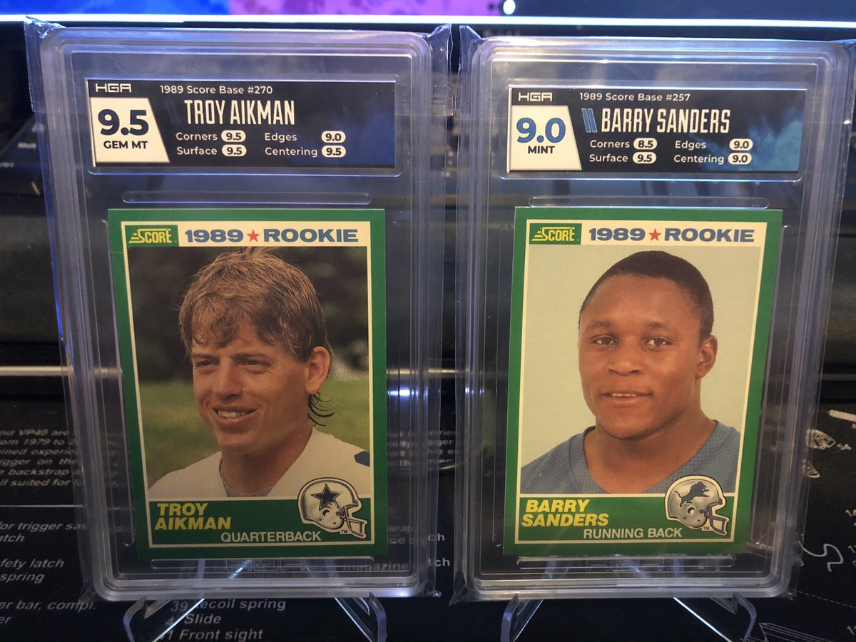 Next up…

1989 Score @TroyAikman RC GEM MINT 9.5!!!!!!!
1989 Score @BarrySanders RC MINT 9.0!!!

These are savvy!!! Loving it!!! @GradingHybrid #collect #GradeReveal