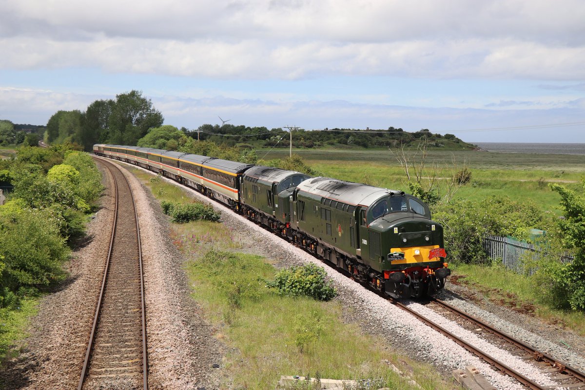 37667 is seen leading 37521 as they pass through Bagillt working the Three Peaks From A Seat 2021 : Day 2 The Coasts And Peaks Rover 1Z16 13:13 Llandudno Junction to Carlisle on the 11th June 2021.