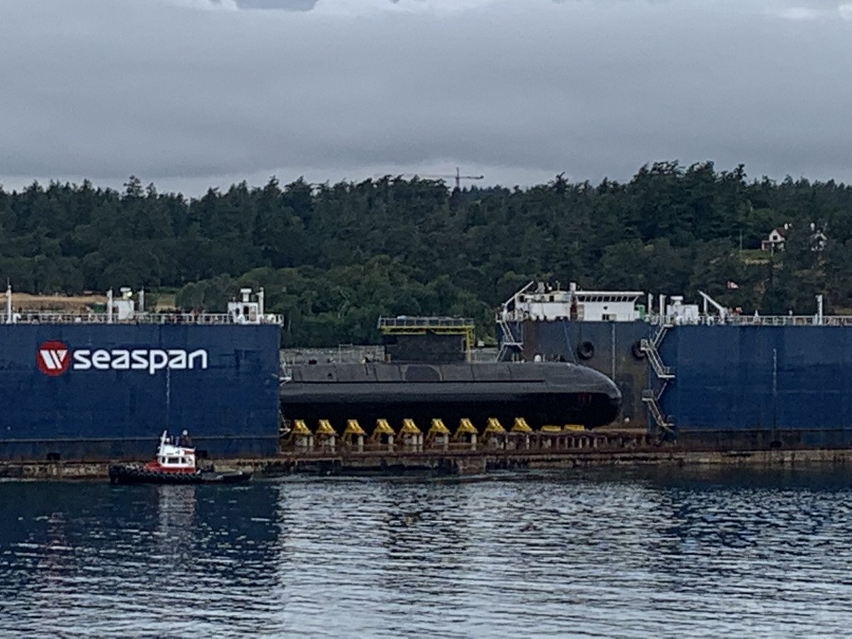 AngusTopshee's tweet photo. It may be grey and overcast in Victoria but it is shaping up to be a #GreatNavyDay for Canada’s Sub Force as a very shiny #HMCSCornerBrook is towed out aboard #SeaspanCareen to be refloated later today

#WeRuleTheSea https://t.co/8KT6Ybl9Ny