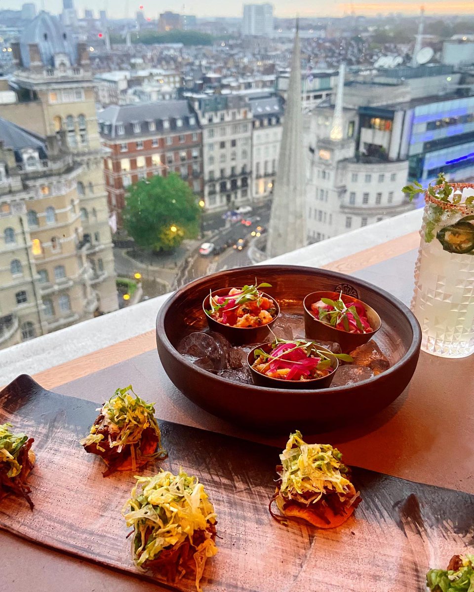 Dinner with a view at maderalondon 😍 Beef barbacoa tostaditas and ceviche trio (seabass, salmon &amp; ahi tuna) ➡️ chicken mixiote enchiladas and chicken served over hot lava stone with sweet-chipotle, onion, mixed pepper served w/ pico de gallo, tortillas, rice &amp; beans 😋🙌 #mader
