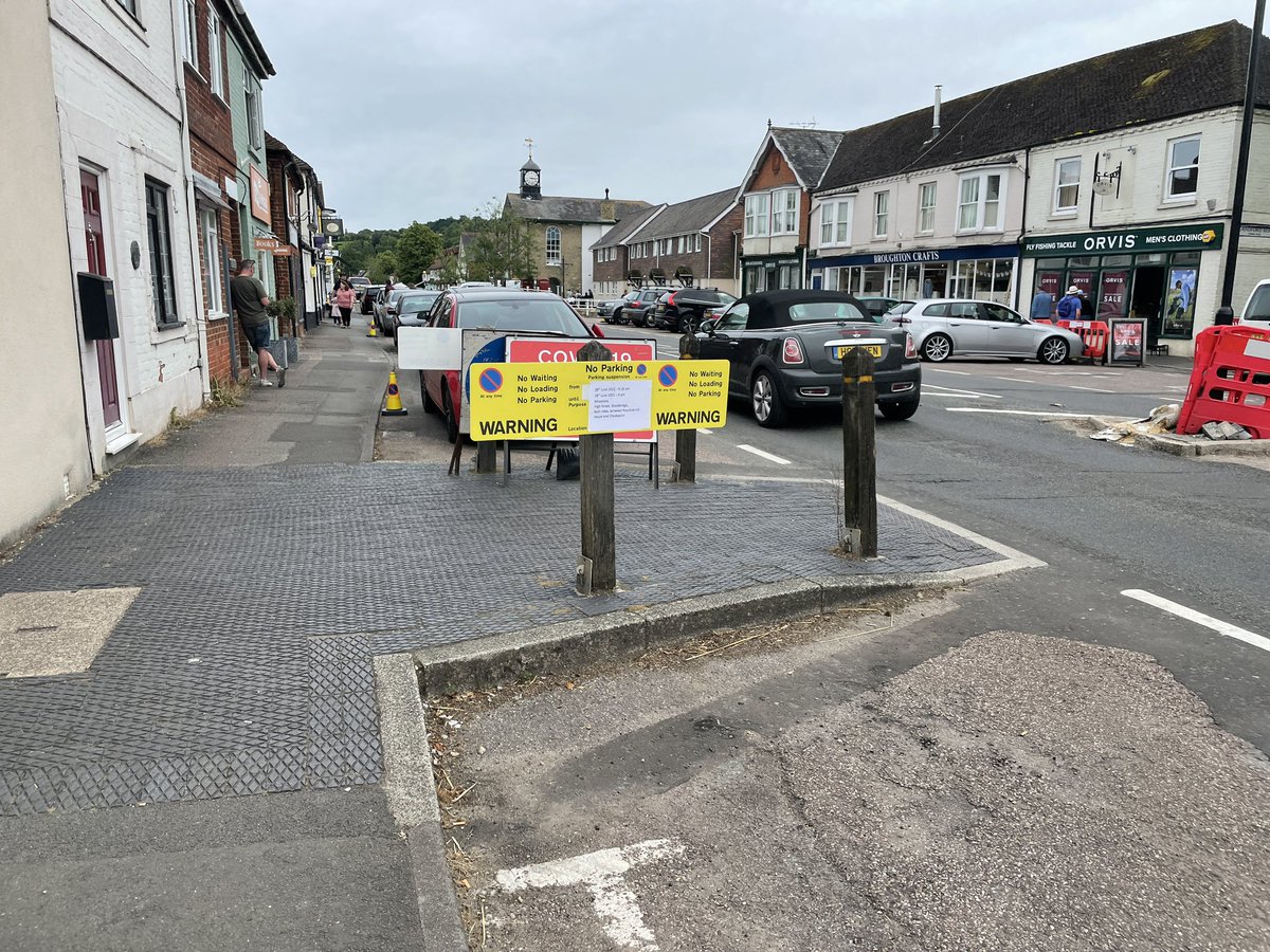 daveingram's tweet photo. @hantsconnect what’s with these fake parking restriction signs and cones at the top end of Stockbridge high street? Are they for real? Looks like house owners just making it up, and impeding other locals from parking. It’s an untidy mess? Are you going to crack down on it? https://t.co/Mx0hBfkqTY