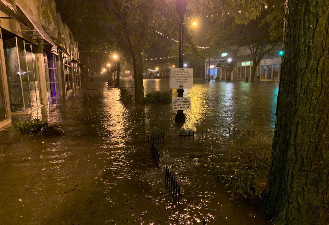 DetSandra's tweet photo. When your job is covering water infrastructure for @GreatLakesNow at @detroitpublictv, your husband mops the basement while you document the neighborhood. Here's what we experienced when pumps failed overnight during heavy rain and what #GrossePointePark looks like this morning: https://t.co/mXpgJwkBqa
