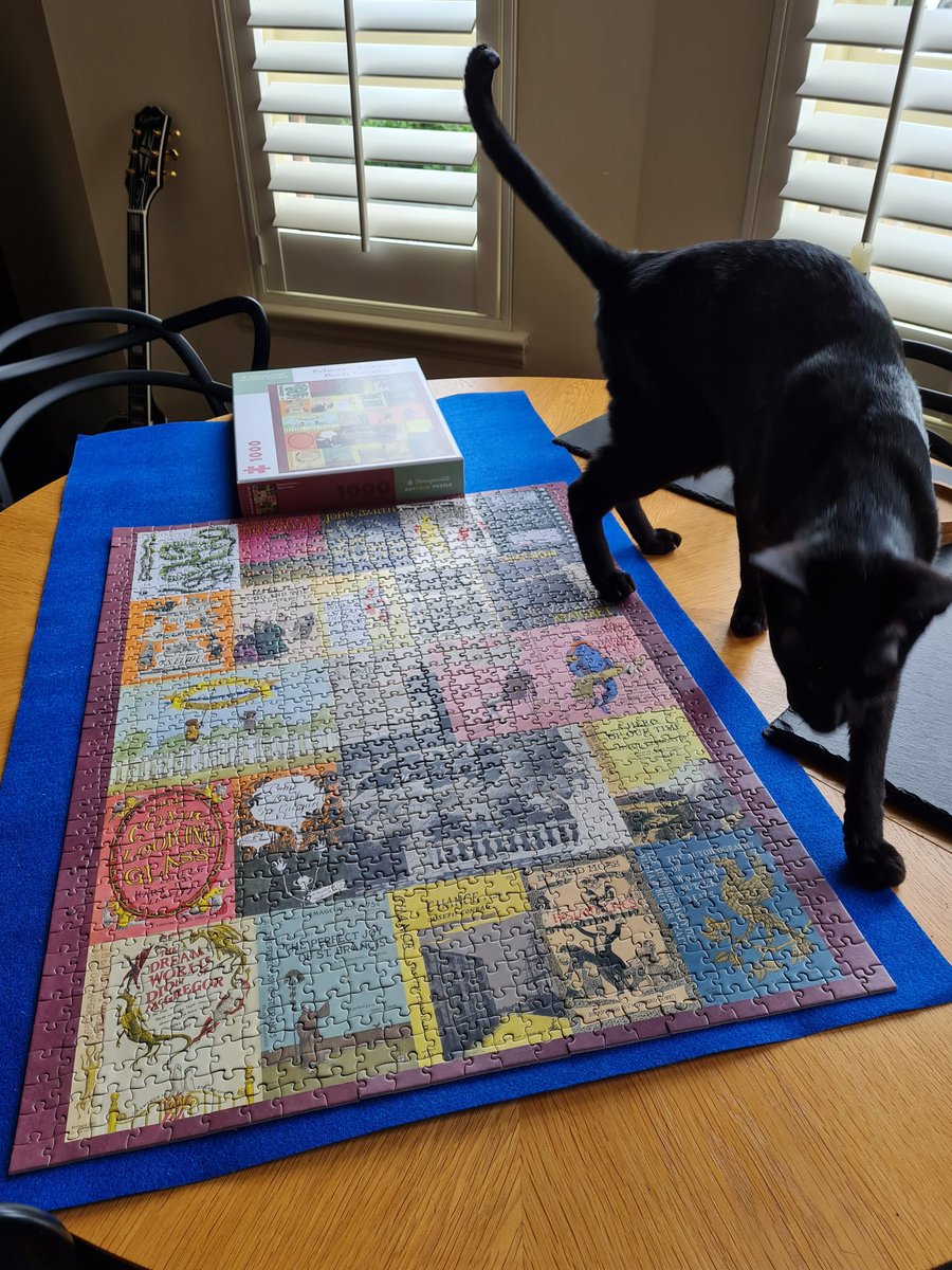 johnstf's tweet photo. Got some help with the  Edward Gorey's Book Covers jigsaw. 😺 @PomegranateComm #pomcom #CatsOfTwitter https://t.co/X5EFkN33yU