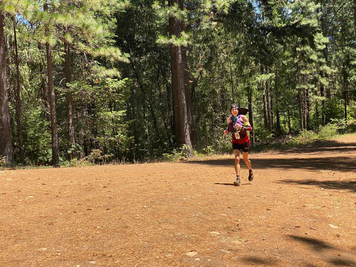 Katie Asmuth is third through Mile 49.5, 11 minutes back of lead. She’s the happiest runner we have seen through this reporting location. Her hat has a lot of flair! #WS100
