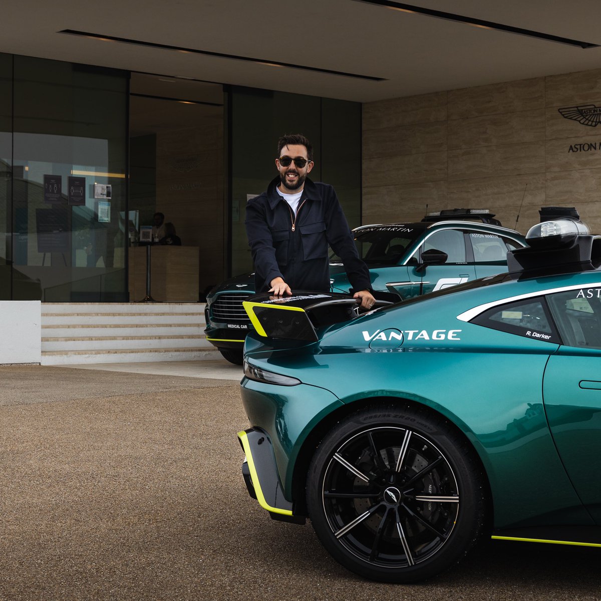 tr_howard's tweet photo. Lights out at the #styriangp today, and what better way to have started #astunday and support @AstonMartinF1 than to get personal with the Official @F1 Safety Car and it’s road going counterpart. Thanks for having us for #AMcafe @AstonMartinWork. 🏁 https://t.co/Q3Es014OmA