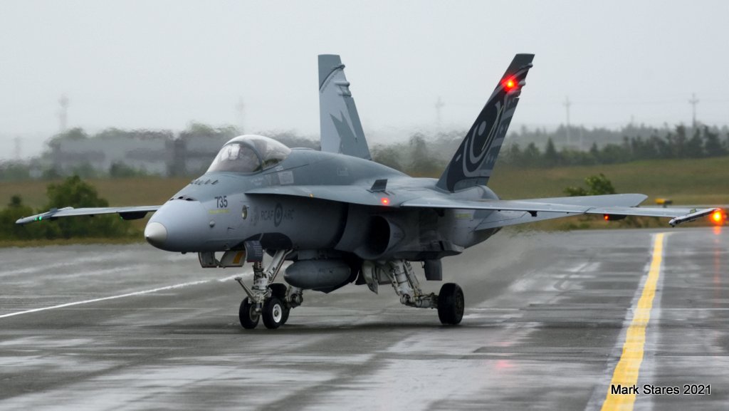 YQXYYT's tweet photo. Hornet 01, the @CF18Demo McDonnell Douglas CF-188A , 188735, arriving at a damp #CYYT for the NL leg of #OPInspiration . Thanks for the passes! https://t.co/ZssultV5G0