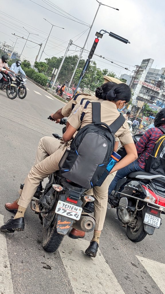 Saichar94696242's tweet photo. What messege are these triple riding police are giving to public??? This picture is caputured at vanastalipuram on 28/06/2021(9:30am).triple riding, without helmet, crossed the stop line at signal &amp; dangerous driving. @KTRTRS @TelanganaDGP @HYDTP please take necessary action https://t.co/94Sktcu66z