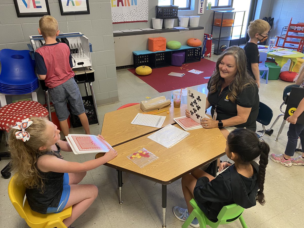 Students are engineering vehicles that are powered by air in 4th grade and 1st grade students are improving their math skills while playing a card game. #HavingFunWhileLearning
