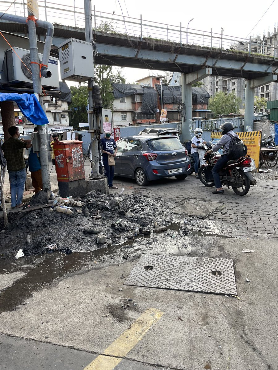 SunilGhate1's tweet photo. Hard work of cleaning drains done by the men on Monday. DK Sandu Rd Chembur. But, the muck wasn’t cleared. I tweeted it. The rain water has partly removed it! Pics on Monday, yesterday & today. @mybmc @mybmcWardN @ChemburChapters @mumbaimatterz @RoadsOfMumbai @smart_mumbaikar https://t.co/7YCzfre6lN