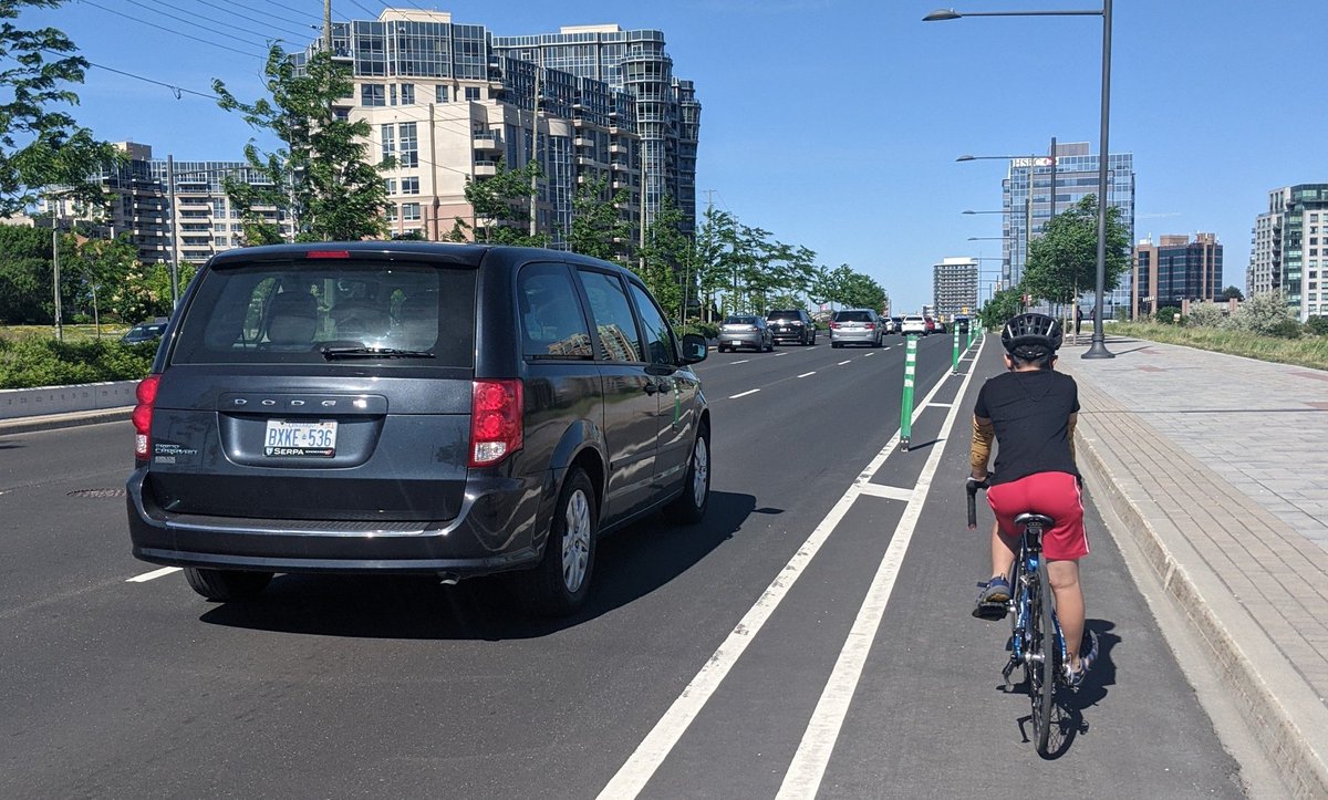 Are these flappy sticks supposed to protect people from anything? This is hwy 7, where drivers love to race.  Catching them texting is always great to see as well. #protectedbikelanes