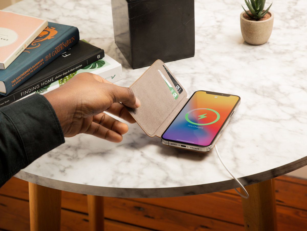twelvesouth's tweet photo. Say hello to #SurfacePad for #iPhone12 📱This feather-light leather cover is one of the ONLY folios with #MagSafe. Best of all, with slots inside the front cover, there’s no need to remove SurfacePad to access your cards 𝘰𝘳 charge your phone! Shop here - https://t.co/8z8Q3zFE1i https://t.co/sRHWmhC2f0