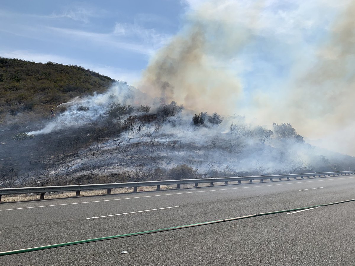 OCFireAuthority's tweet photo. Firefighters on scene of a vegetation fire on the SB 73 just west of the 133.  Avoid the area. More info to follow. https://t.co/mX5vhR6PGu
