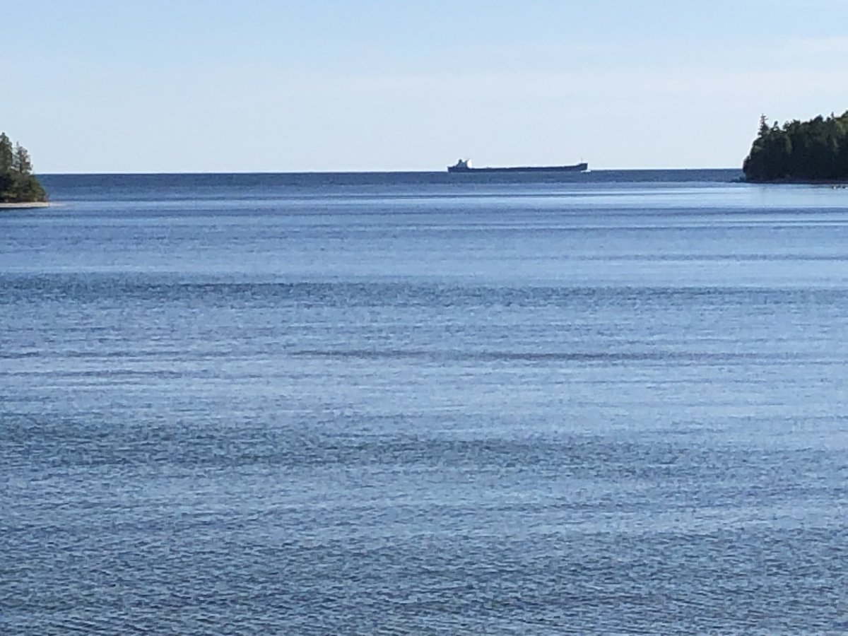 WriterCBennett's tweet photo. A freighter easing into the Detour Passage from #LakeHuron , heading toward the Soo Locks. #Freighters #GreatLakes https://t.co/pqMzwfyGND