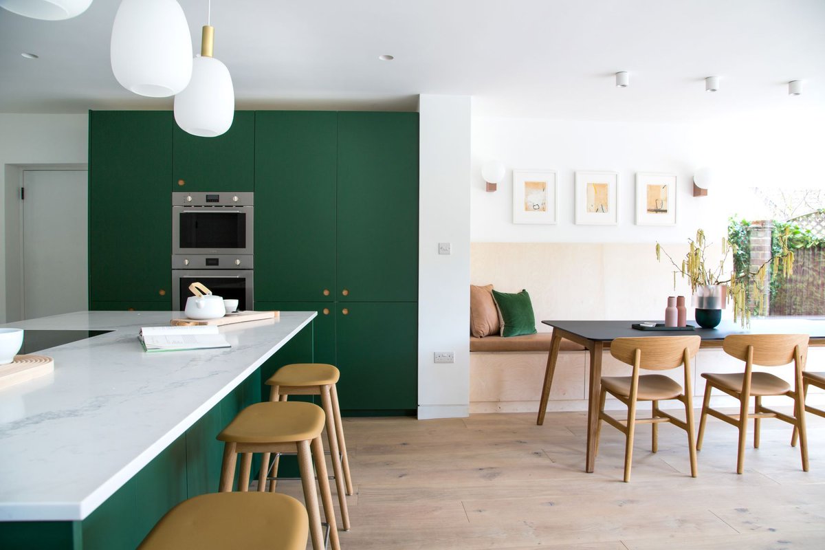 The forest-green ladbroke cabinetry in the Ascot kitchen adds a fantastic pop of colour to this contemporary space. Credit to AmazingTelly Productions Photographer: Daniela Exley Architect: Chris Dyson Stylist: Edwina Boase #NakedKitchens #TrulyBritishTrulyBespoke