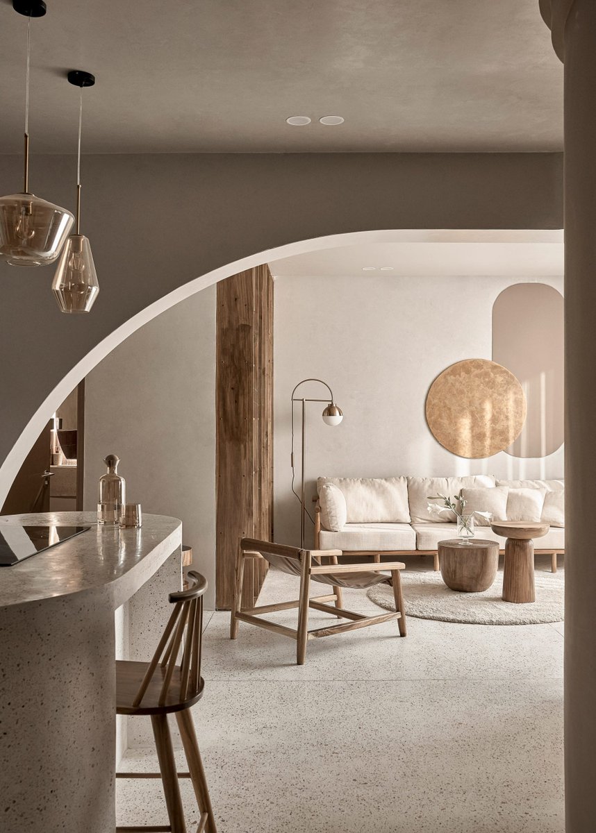 Design Inspiration: Architecture firm Limdim House Studio has renovated the Brown Box apartment in Vietnam adding curving walls, tiered cornices, and terrazzo surfaces that aim to create a "calm" and "gentle" space. #architecture #interiordesign #design #inspiration