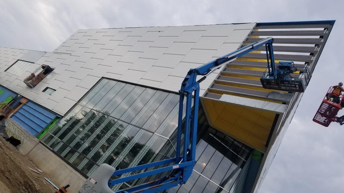 CSPArch's tweet photo. Applying aluminum panels to the "prow" of the @UWindsor Lancers Centre - exciting to see the progress on this great project!
#progressphotos #constructionpics https://t.co/hJWZG94noR