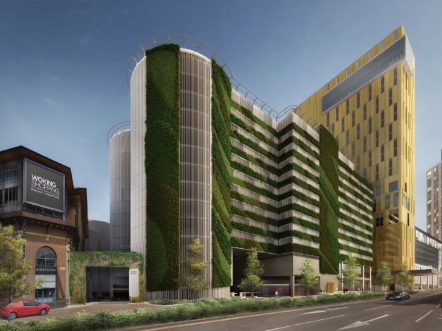 wokingcouncil's tweet photo. Installation of Woking town centre's fourth green wall, on the new car park at Victoria Place, has commenced! a total of 7,000sqm of foliage on the wall and roof will soak up 16,000kg of carbon and produce 11,000kg of oxygen every year! #WeAreWoking #PlanetWoking #CleanAirDay https://t.co/s1VopfSbnF