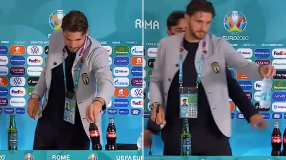 CalculatedWolf's tweet photo. taly midfielder #ManuelLocatelli 
has become the latest player to remove #CocaCola bottles from his press conference table at #EURO2020 😎🤘.

Let's remove All poisonous bottles from the desk 🙂. https://t.co/Mq1BjI96q6