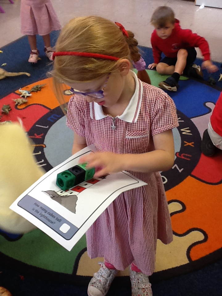 MayalsSchool's tweet photo. Meithrin have been busy problem solving this week, trying to guess how many blocks match the lighthouse and seeing who has used the most and least blocks. A challenge set by Anwen, the Ambitious, Capable Alien. #MayMathsNum #MayCurriculum https://t.co/Xe5Mx3NSBR