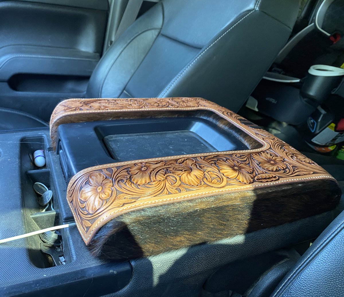 Cowhide wrapped console with custom tooling. For your viewing pleasure