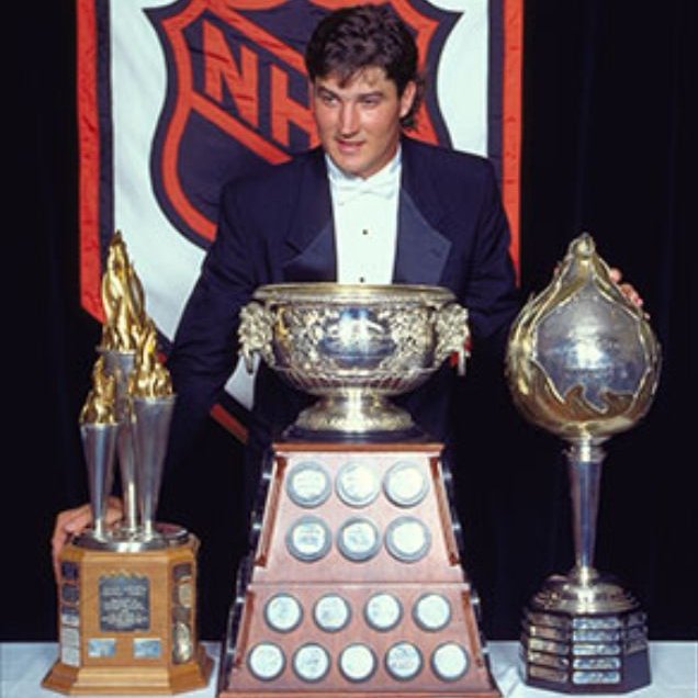 On this day in 1993, the <a href="/penguins/">Pittsburgh Penguins</a> Mario Lemieux- thanks to a phenomenal 160 point (69G-91A in 60 games) 1992-93 in which he batted Hodgkins' lymphoma- becomes the only player to date to receive the Hart, Lester B. Pearson, Art Ross and Bill Masterton trophies in the same season