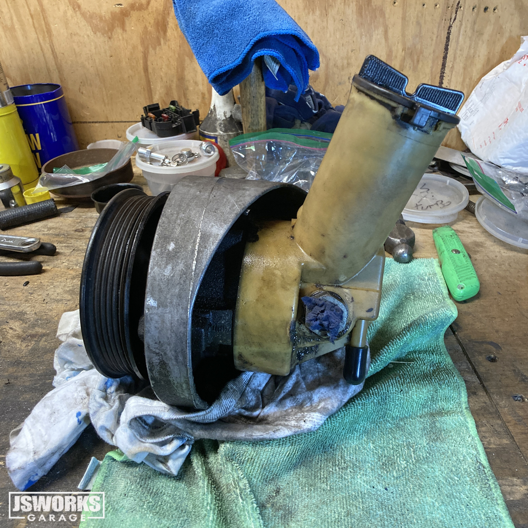 jsworksgarage's tweet photo. Was hoping the bad power steering leak on #ProjectMidLifeCrisis was coming from the lines. They were definitely leaking (badly), but the pump is also leaking from the front seal. Anyone had luck rebuilding the factory PS pump with the kits they sell at auto parts stores? https://t.co/Qf70NcpCxY