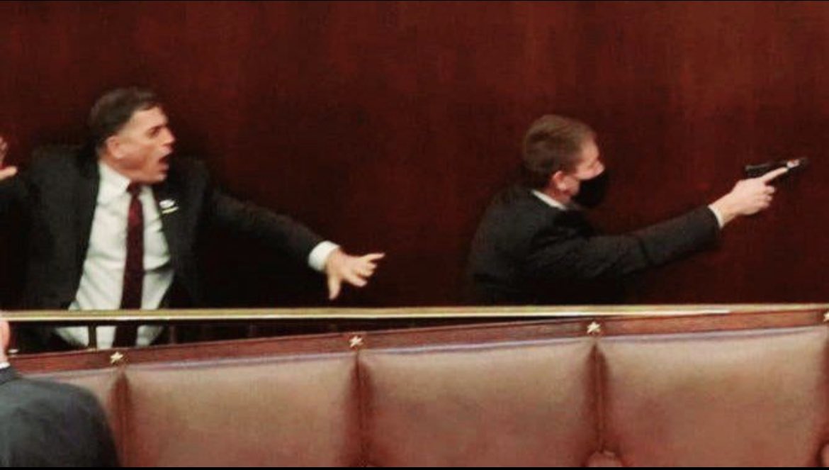 Here’s GOP representative <a href="/Rep_Clyde/">Rep. Andrew Clyde</a> terrified during the Jan. 6 Capitol riots and cowering behind the people whose hand he refuses to shake #AndrewClyde