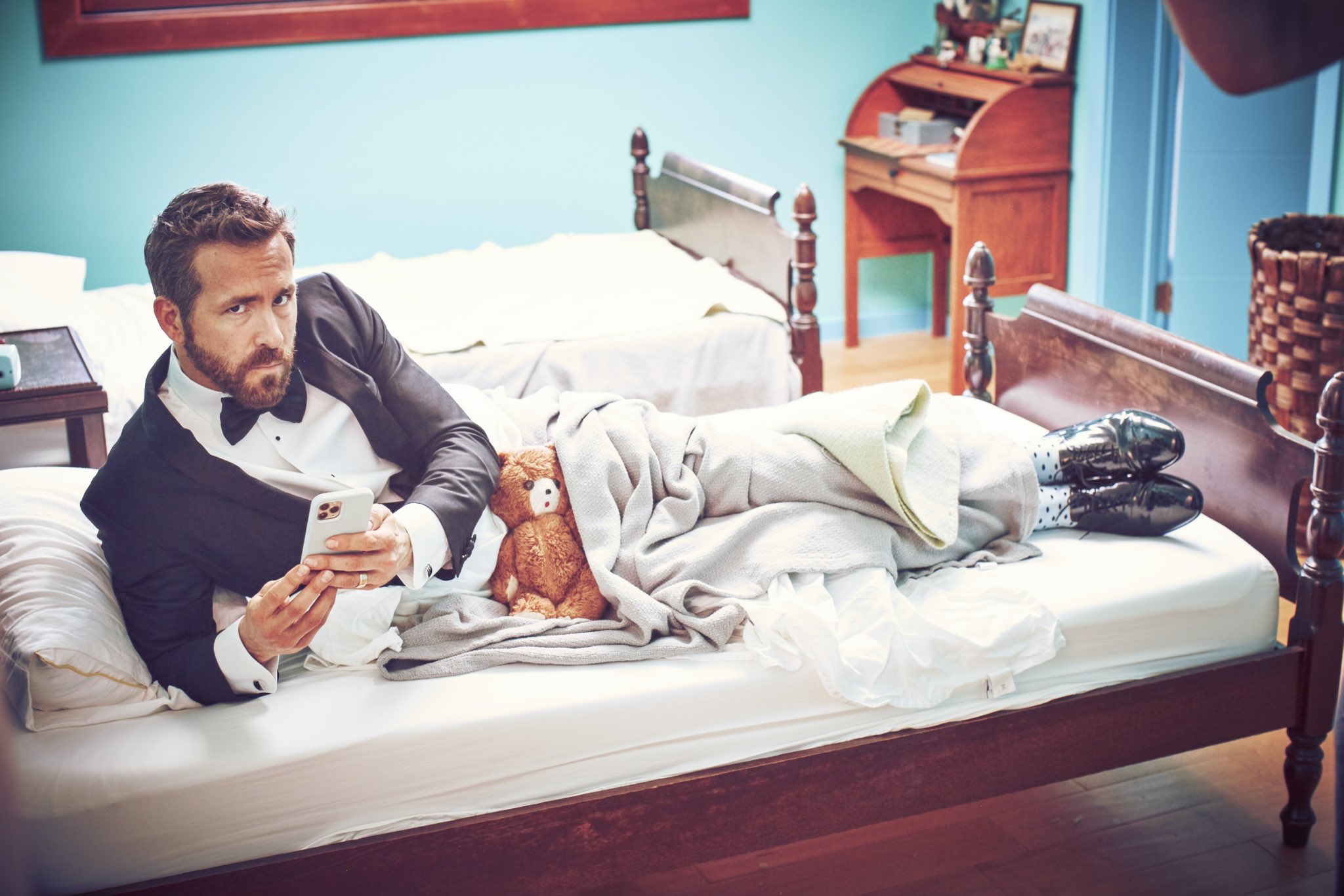 Ryan Reynolds on X: Photographer: the legendary @guyaroch. Tux: rented. Bed:  twin, probably a little snug for someone my height. The bear? Still trying  to figure that out.  / X