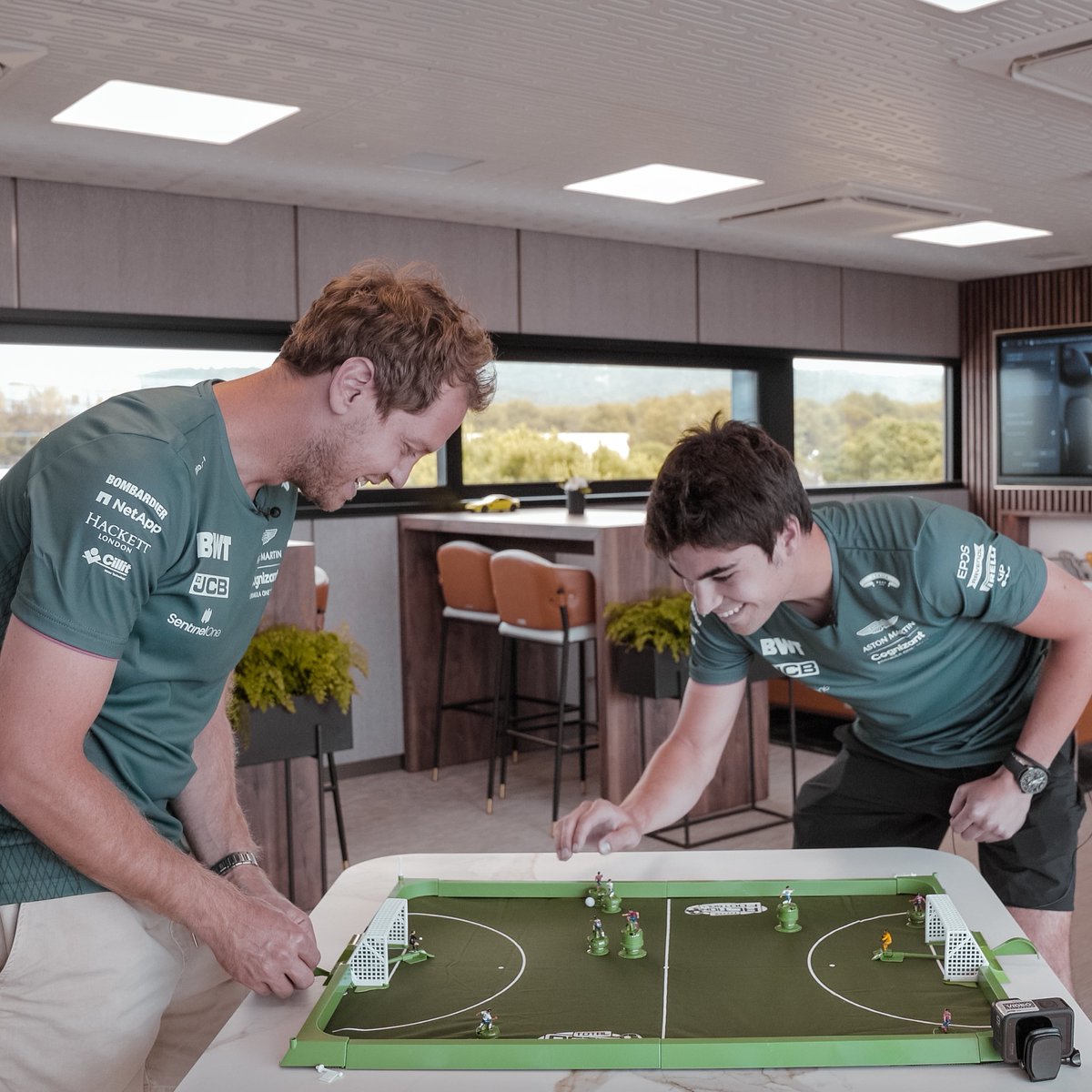 AstonMartinF1's tweet photo. Ready for the biggest match of the weekend?

Kickoff at 11:00 BST Sunday morning... game on. 💚 #Euro2020 https://t.co/2mrZqzKtwV