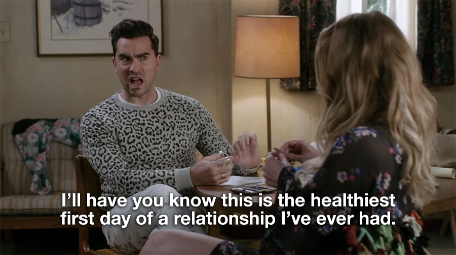 A still image from Schitt's Creek in which David is telling Alexis, "I'll have you know this is the healthiest first day of a relationship I've ever had."