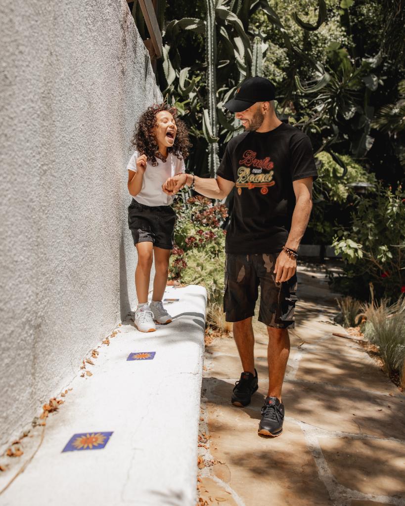 Footaction's tweet photo. .@EnricoMoses is staying fresh in #Rebook. On being a dad to six-year-old Rumi, he says: “Having a daughter has taught me to listen and understand from a different lens. It teaches me more patience and more understanding about everybody around me.” #KeepDadFresh https://t.co/Rfym5tfSqX