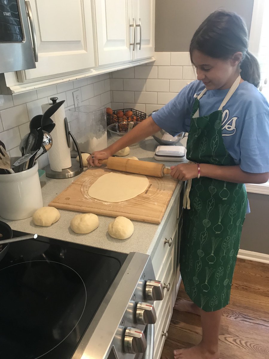 BonnieButellHun's tweet photo. It’s 🍕 ⁦night thanks to owls in the kitchen camp. Of course, it’s a million degrees, but she was eager to show off her new skills 👩‍🍳 ⁦@MuhaFACSOW⁩ https://t.co/T8QZESCDYn