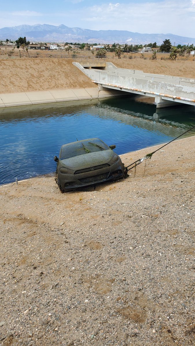 SBCSDDiveTeam's tweet photo. The sheriff's dive team and San Bernardino County auto theft task force conducted a joint operation today in the high desert and recovered 15 vehicles out of the aqueduct  spanning over 14 miles of waterway. A press release will follow soon. https://t.co/92qOLUxWsc