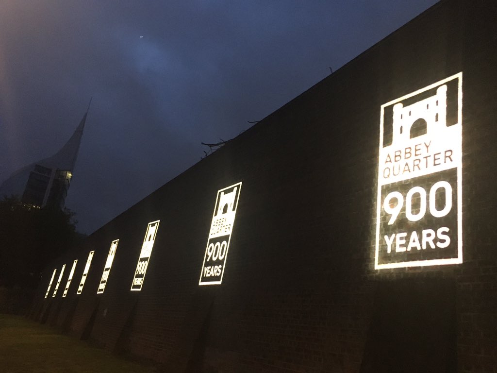 Spiddly's tweet photo. A history lesson in eight illuminations on the wall of Reading Gaol as @RdgAbbey celebrates 900 years of its foundation #RdgAbbey900 #rdg #rdguk https://t.co/u6uCVY4mel