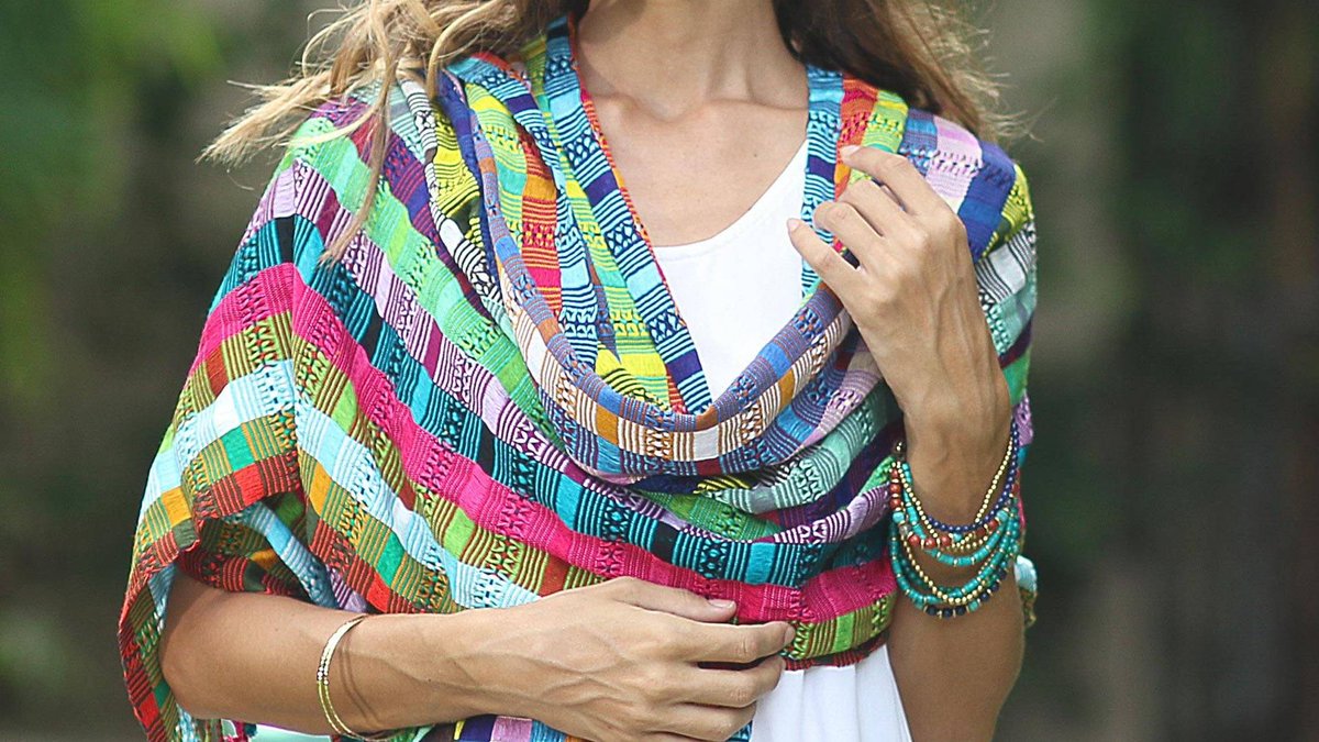 It's been getting warmer but that doesn't mean you might not need something pretty and light to throw over your shoulders as the day turns into evening. With ribbons of rich colors, this cotton shawl is the perfect accessory. See it here: bit.ly/3gCIekY. #handmade4life