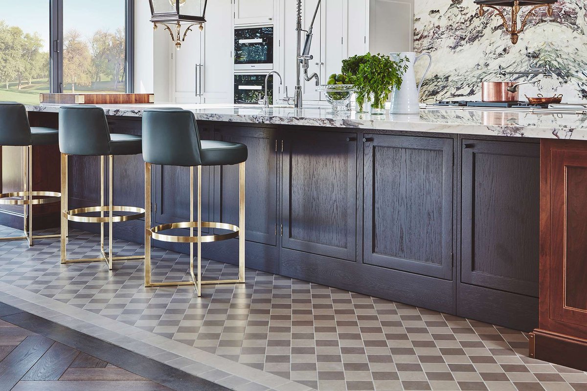 The Shaker cabinets can transform a contemporary space. In our Chester Row project they are simple and sophisticated and sit perfectly alongside the elegant marble. The patterned floor feels natural and contrasts perfectly with the walnut timber and the cabinetry. #NakedKitchens