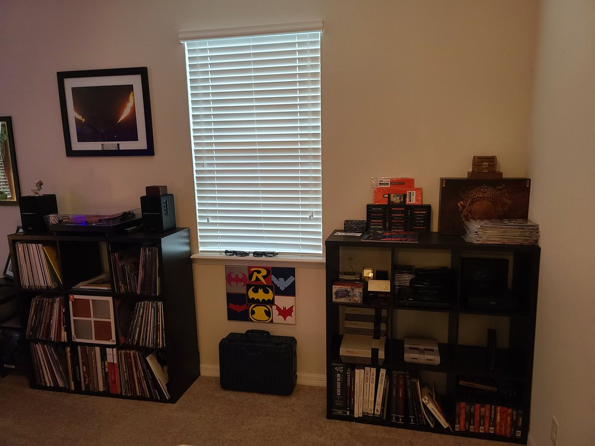 BrettHrin's tweet photo. Just moved into my new house and finally, mostly, got my game room together. Still needs some organizing and I may move stuff around but what do you think?

#SwitchCorps #GameRoom #ManCave #PlayStation #Xbox #NintendoSwitch #vinyl #vinylcollection #GameCollection https://t.co/Jl1a4y3aG2