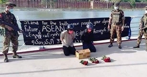Army with Rifle in full Attires,

Civilians with flowers for The lady's Birthday. 

What a scene in front of historical Last Royal Palace.. 

What a shame... 

Oh dear Gods, Buddha, Jesus, Allah, etc.. 

#76FlowerStrike
#76thDawAungSanSuuKyiBirthday 
#76thBirthday