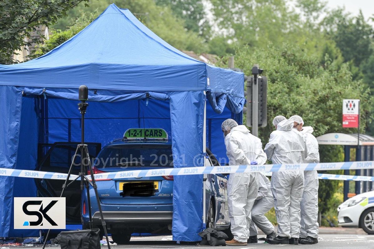 CrimeBirmingham's tweet photo. Investigations continue on Dudley Road East at the scene of a fatal #shooting.

Forensic investigator’s this morning can be seen examining a blue taxi, which until now has been covered by a blue tent. #Tividale #Oldbury #WestMidlands @snappersk #SnapperSK https://t.co/QtQDKojI99