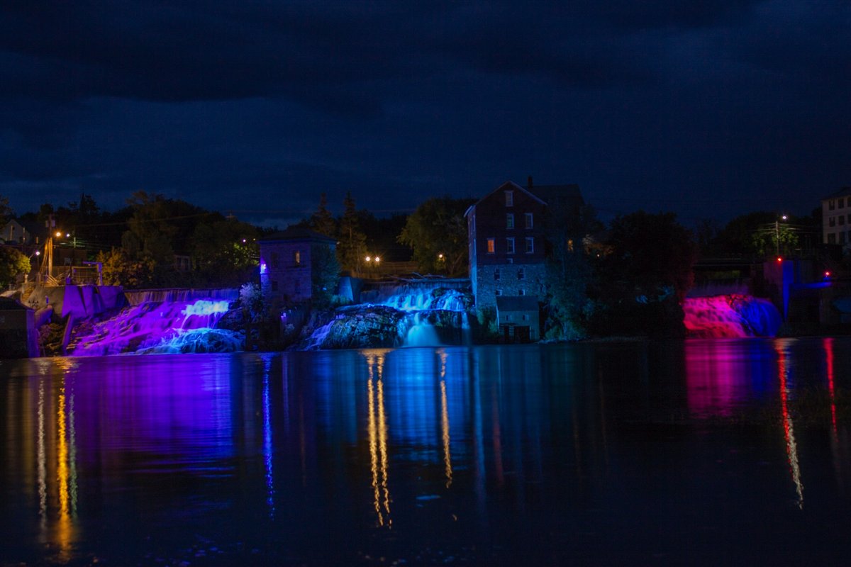 vtaudiovisual's tweet photo. The #Vergennes Falls are lit once again... a sure sign of summer! You can view this lighting display at dusk every day through Labor Day. Best viewing location: https://t.co/LQTcXDVgDi #vermont #btv #waterfalls #nature https://t.co/UMT5c1Aq6g