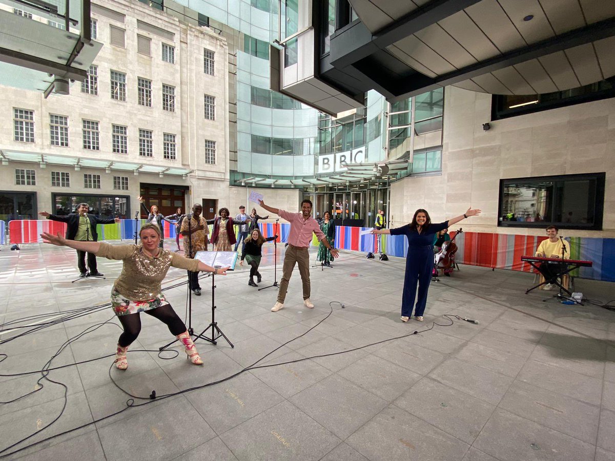 Lovely photo of us <a href="/CotWChoir/">Citizens of the World Refugee Choir 🧡</a> performing outside the #BBC for <a href="/bbcsml/">BBCSundayMorningLive</a> today. 

A warm welcome from <a href="/SeanFletcherTV/">Sean Fletcher</a> and <a href="/Nina_Wadia/">Nina Wadia OBE</a> thanks to both of you and your brilliant crew 🥰 

It’s #RefugeeDay #RefugeeWeek2021 and we say and sing that #RefugeesWelcome! 💜💚🤍