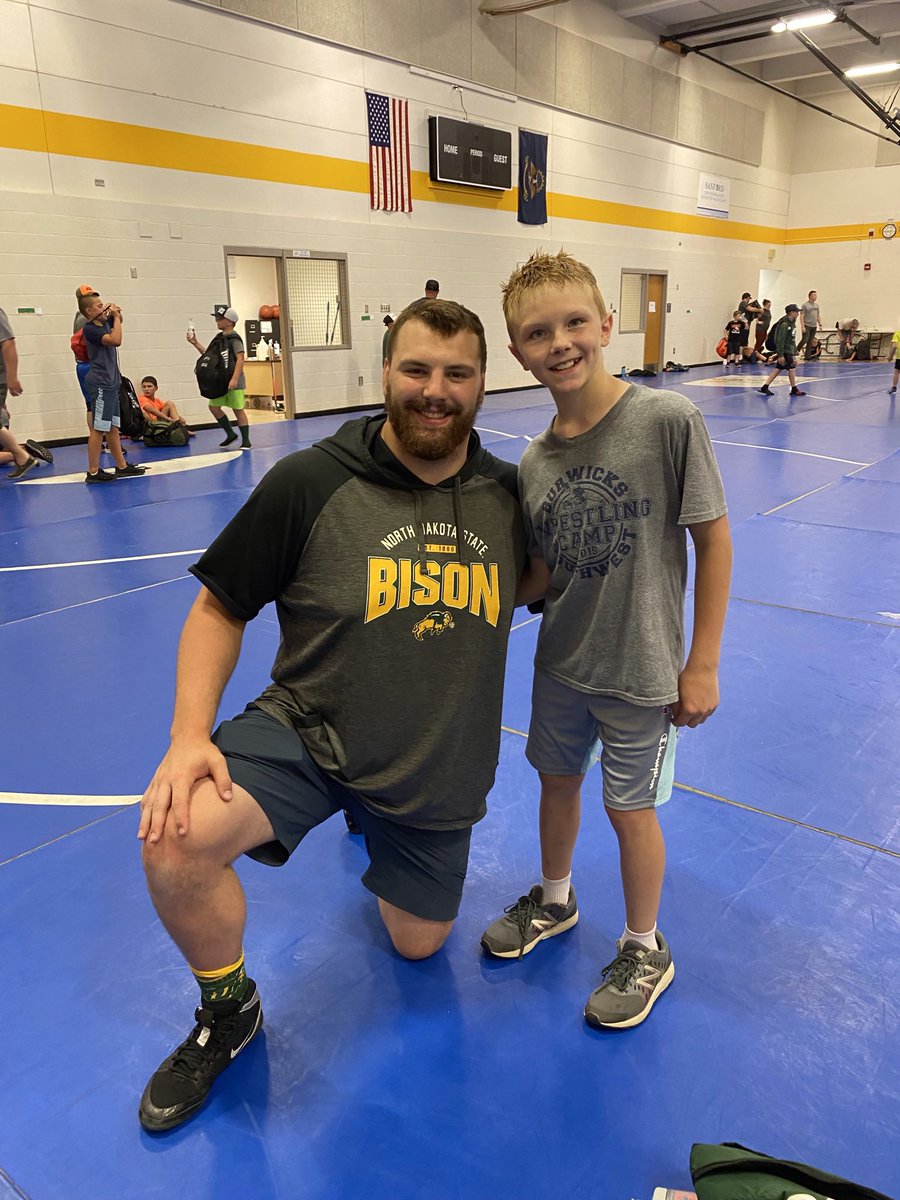 MaynardSaffy's tweet photo. Rhys got some coaching from one of his favorite wrestlers, @brandonbison48 at the @BWCRTC youth camp. Throwback 4 years. Looks like theyโve both grown a little. One is definitely shaggier. Thanks for giving back to the sport! #metzmode https://t.co/rWmlL71Egf