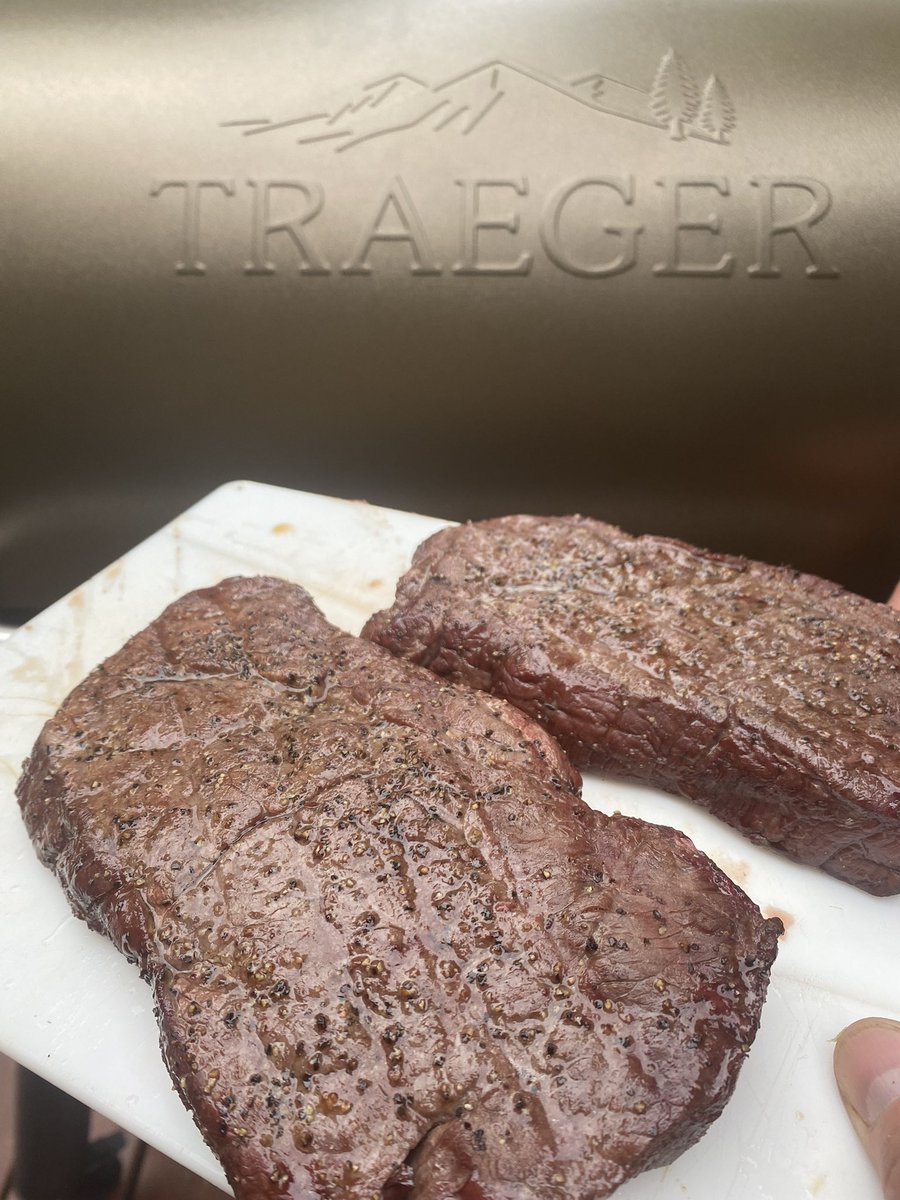 HelveyComm's tweet photo. Broke in the new fire pit area and Traeger with moose steaks and deer back strap. Kids are playing football in the back yard and warming up the hammock. #alaskalife #summer #TraegerGrills @TraegerGrills https://t.co/bgmZp2UWfz